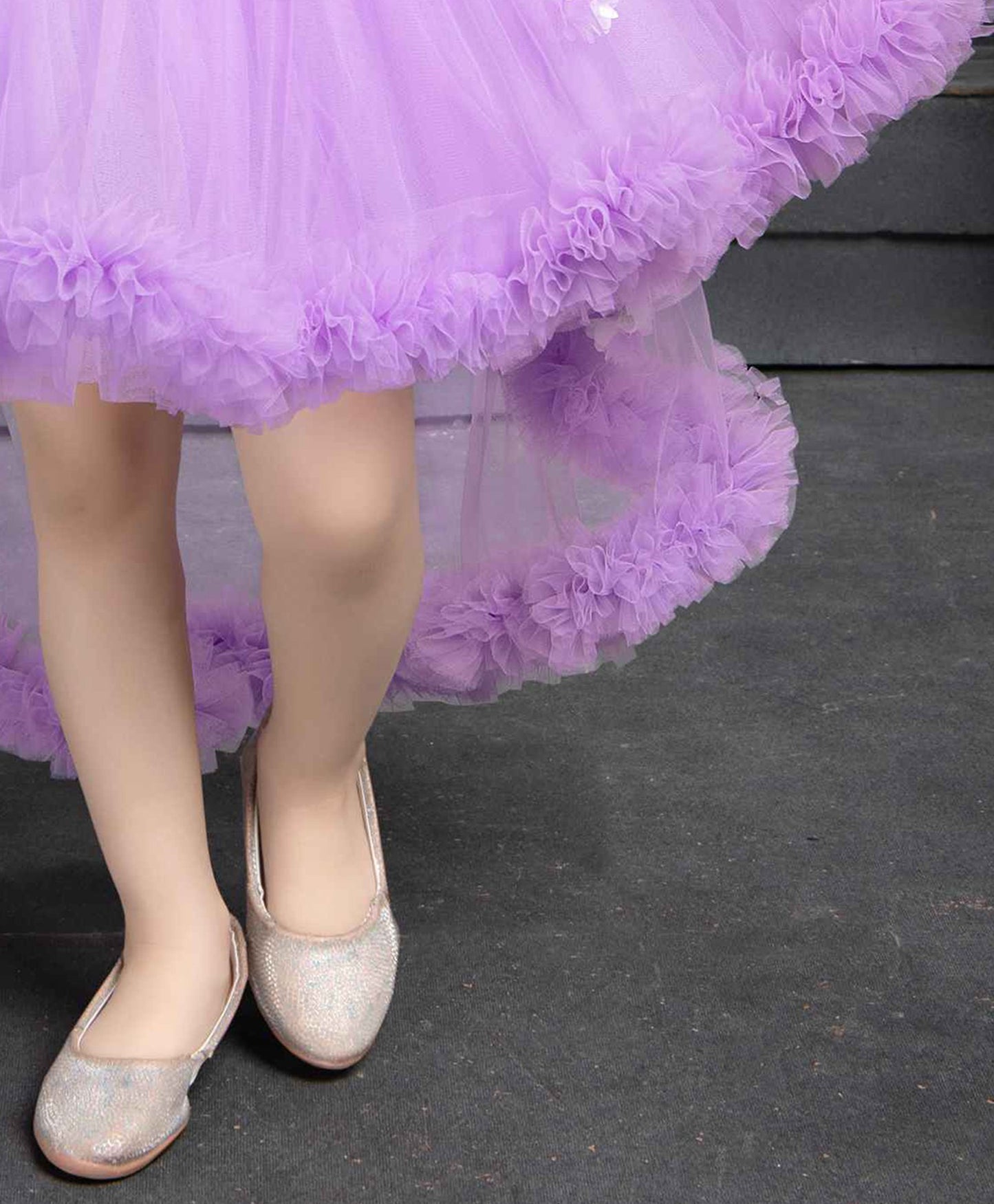 Purple Ruffled Net Tailback Frock With Floral And Butterfly Embellishment For Girls